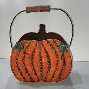 Kirklands Metal Orange Pumpkin-Shaped magazine holder faux florals basket bucket